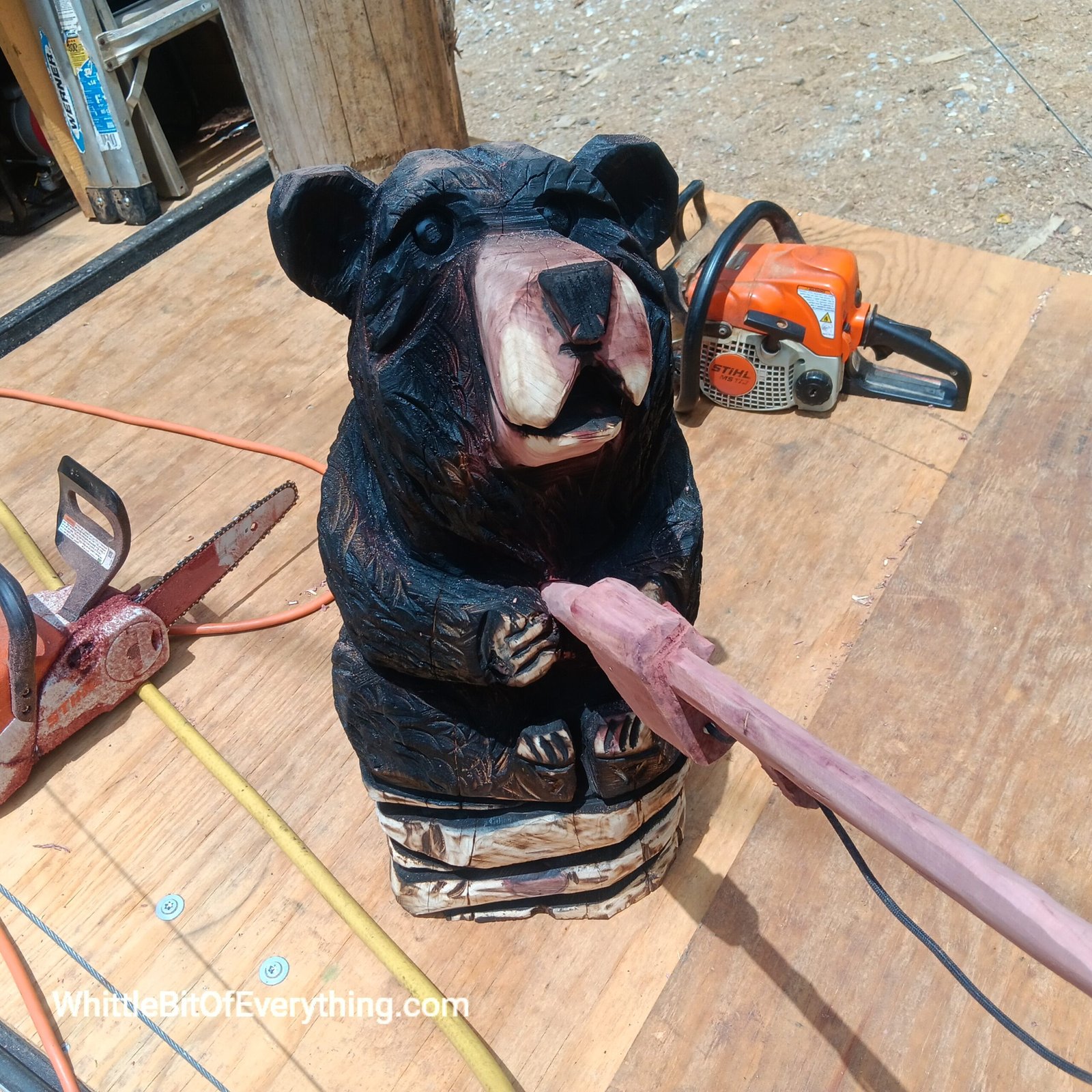 Chainsaw carved bear fishing